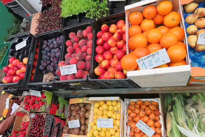 Vibrant display of fresh fruits and vegetables at a local farmers market in Funchal, highlighting a colorful 4WD tour experience.