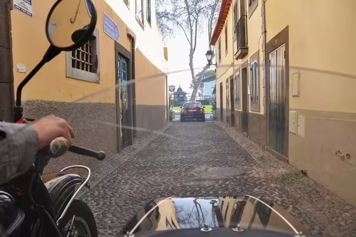 Exploring Funchal’s charming cobblestone streets on a vintage sidecar tour, perfect for one or two adventurers.
