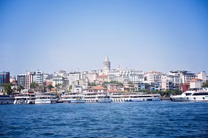 Galata Tower skyline from the Golden Horn with ferries, ideal for an all-inclusive private guided Istanbul tour