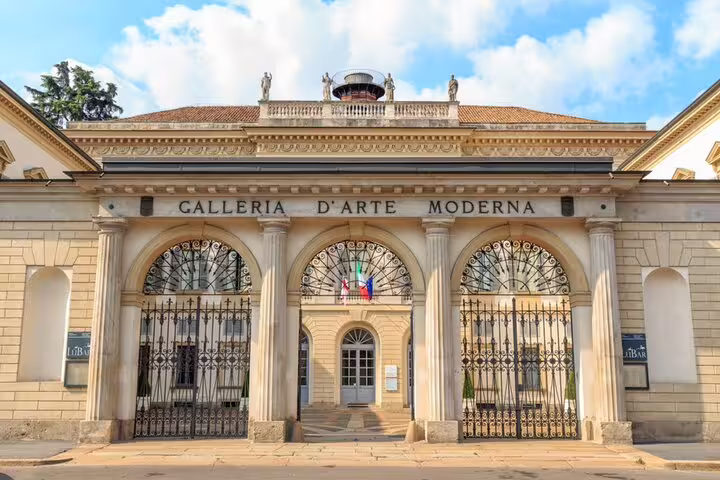 Galleria d'Arte Moderna facade with ornate arched gates and columns in Milan