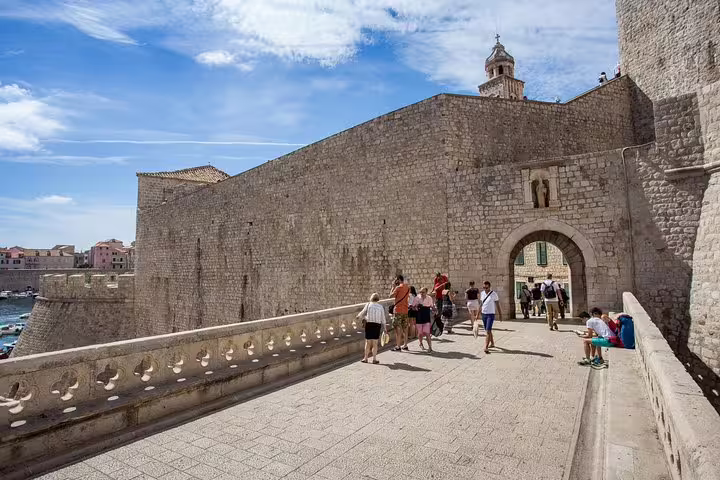 Walking the Dubrovnik city walls near Pile Gate, a highlight of the Total Game of Thrones experience tour