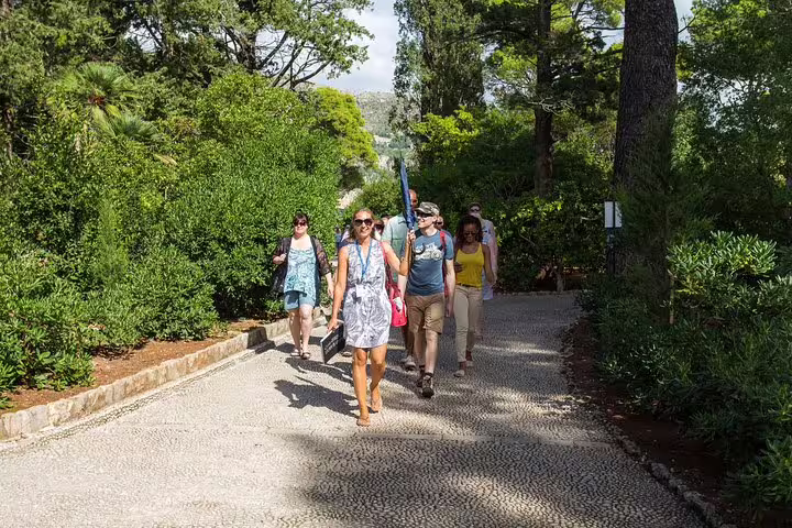 Group walking through Dubrovnik park trails en route to Game of Thrones filming locations on guided tour