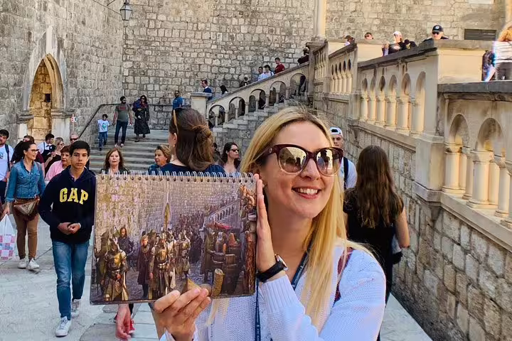 Guide compares Game of Thrones scene book on Dubrovnik Old Town steps, King's Landing streets group tour