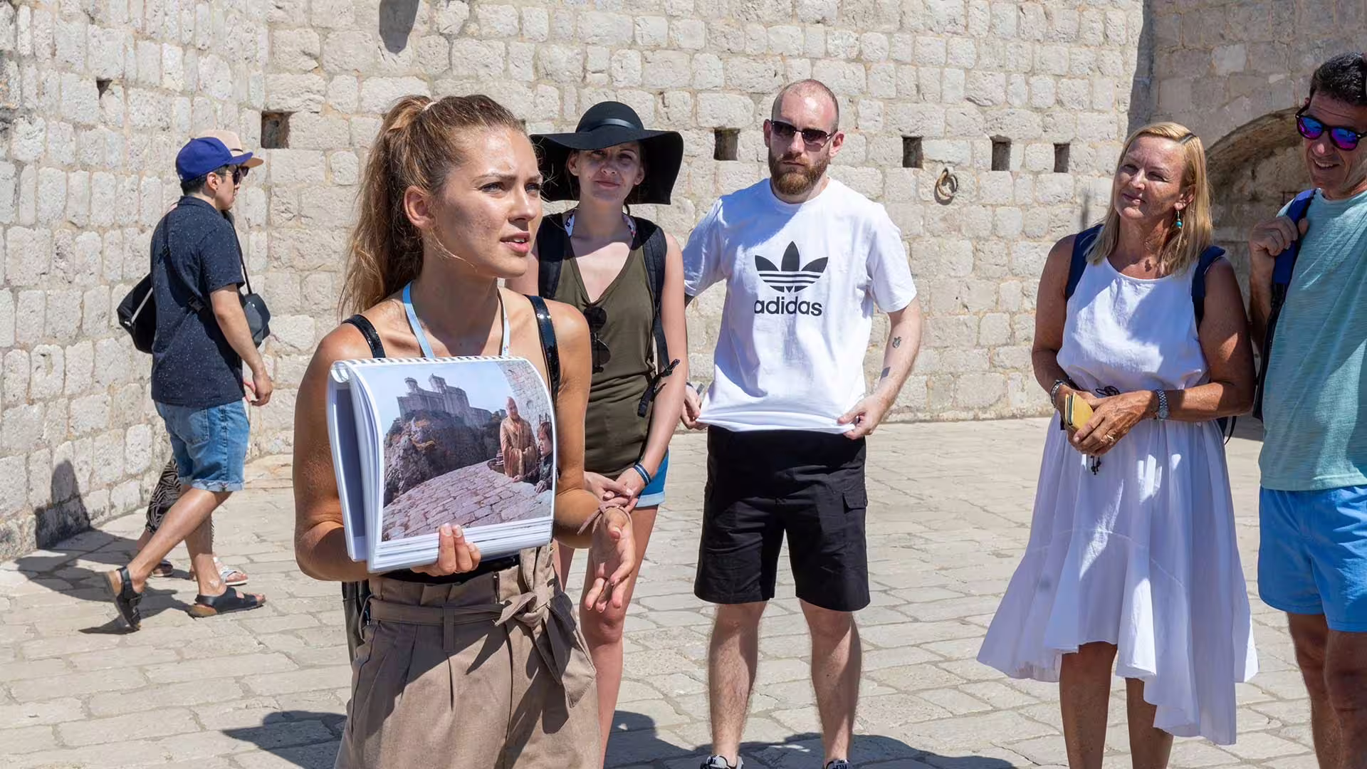 Private guide in Dubrovnik fortress explaining Game of Thrones filming locations and medieval history to guests