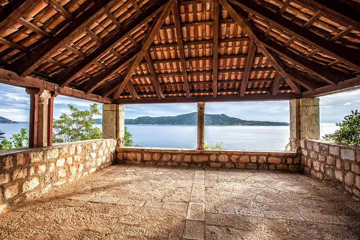 Stone terrace with wooden roof overlooking Adriatic sea, Game of Thrones group tour filming location Dubrovnik
