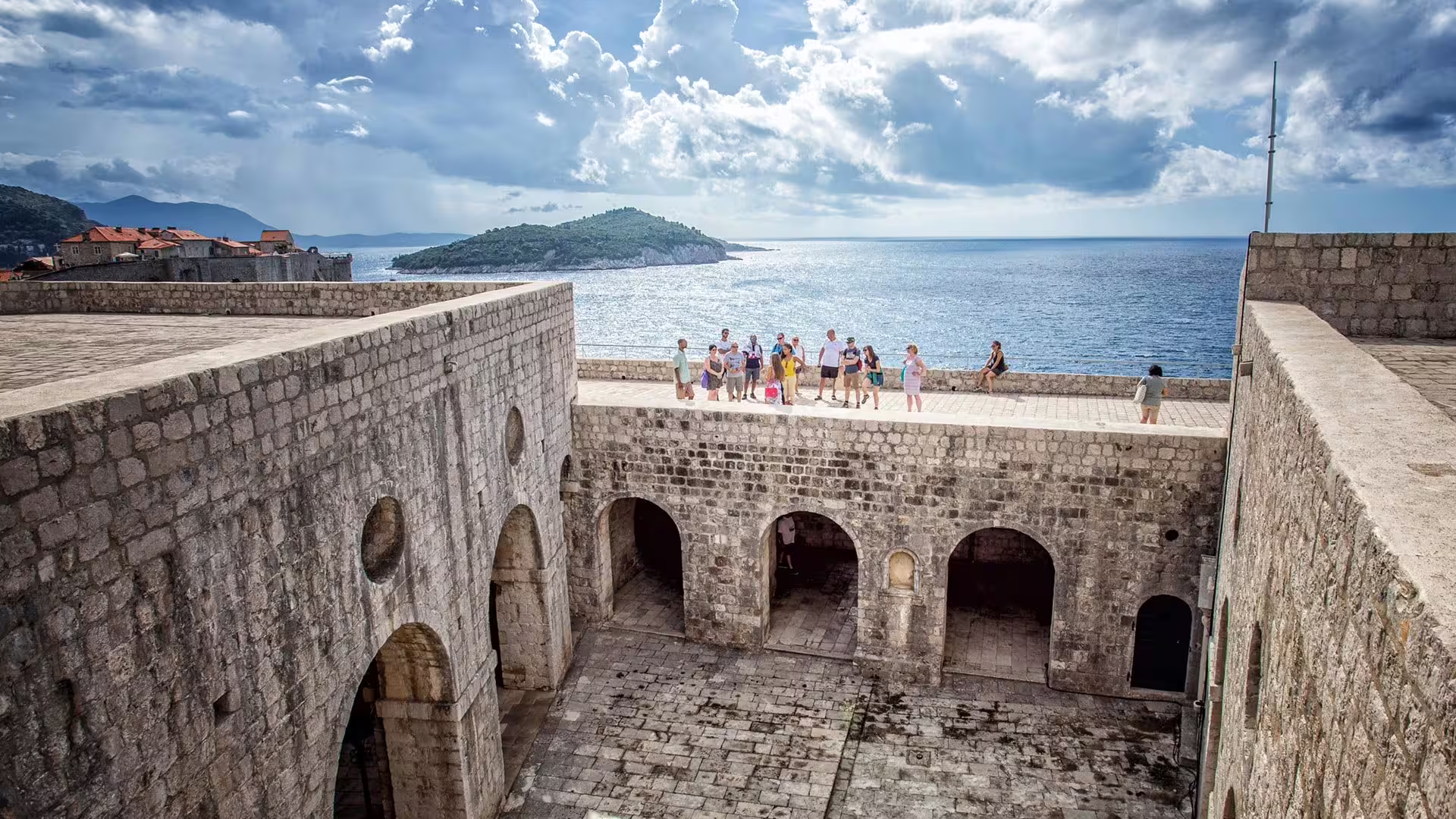 Group on Dubrovnik Old Town walls overlooking Adriatic on Game of Thrones and history private combo tour