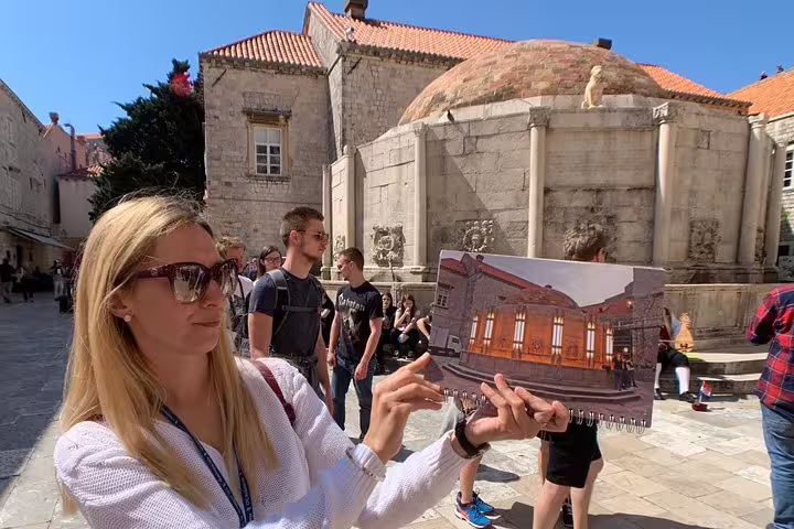 Guide shows Game of Thrones scene match in Dubrovnik Old Town on the King's Landing streets group tour