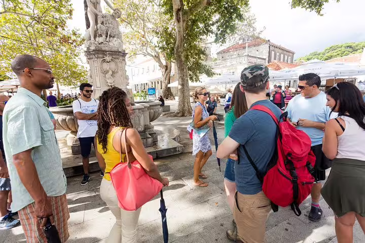 Tour guide briefing guests at Dubrovnik square, meeting point for Total Game of Thrones Experience group tour