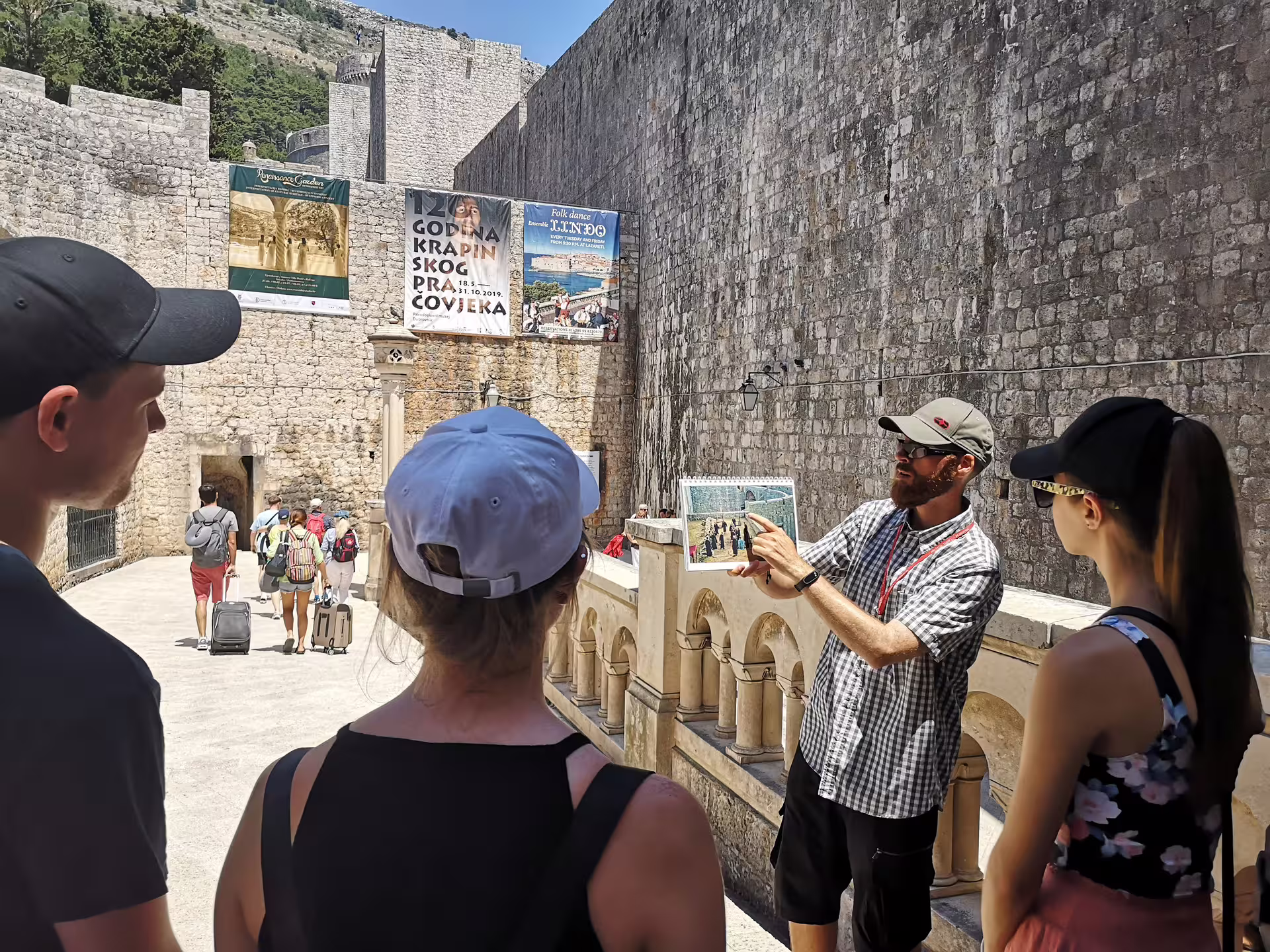 Guide briefing group at Dubrovnik city walls on a Game of Thrones walking tour, filming locations explained