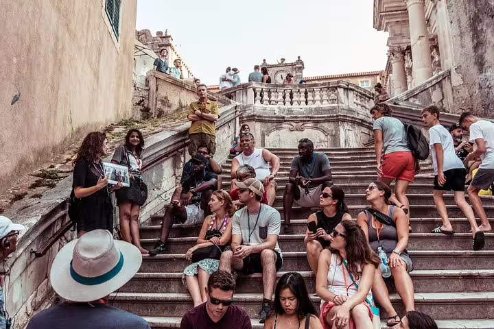 Tour group resting on Dubrovnik Jesuit Stairs during a Game of Thrones walking tour of King’s Landing sites