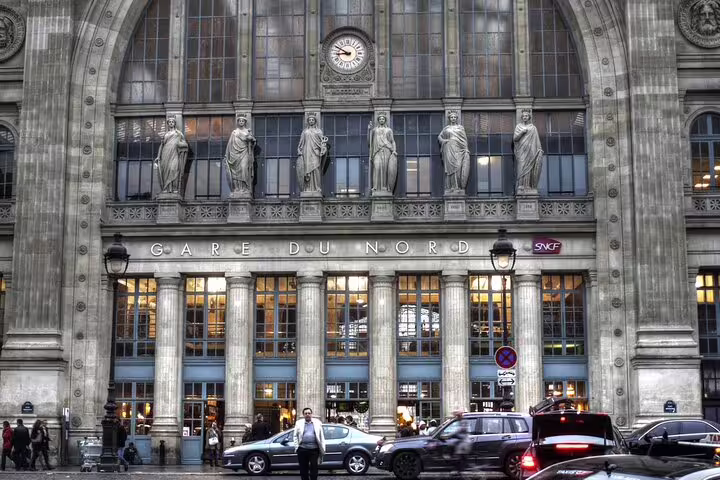 Gare du Nord train station facade with classical statues and columns in Paris