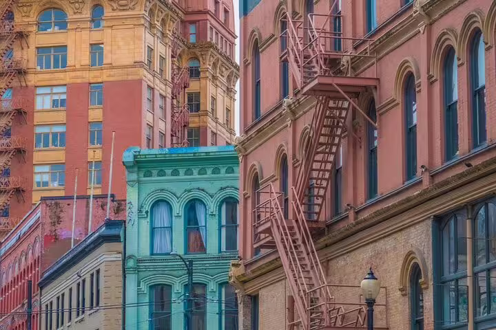 Colorful historic brick buildings with fire escapes in Vancouver Gastown neighborhood