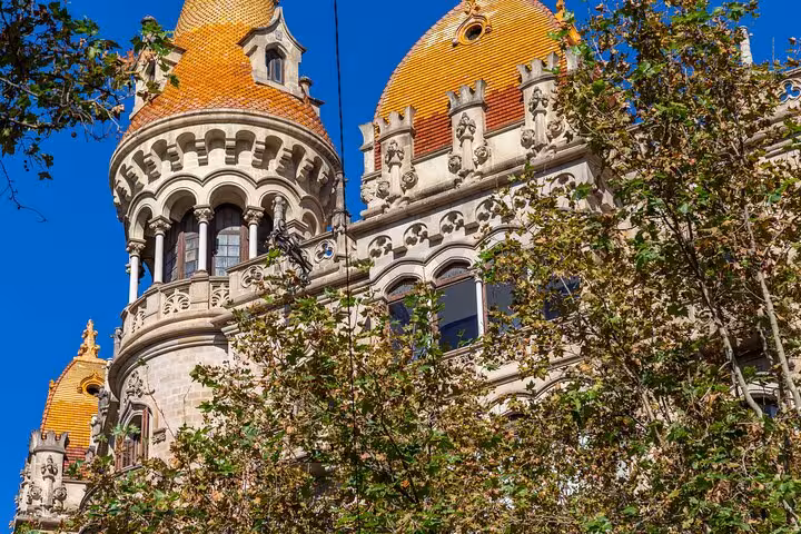 Modernist facade with orange domes of Casa de les Punxes, a highlight on the Gaudí walking tour Barcelona