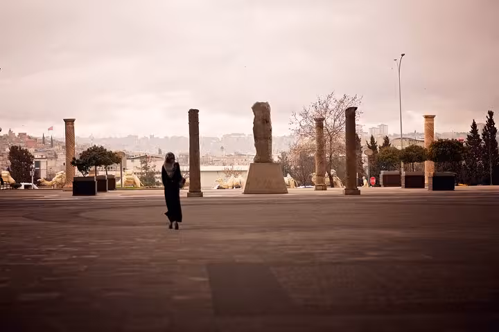 Open plaza with ancient columns and city skyline in Gaziantep, stop on an all-inclusive private guided tour