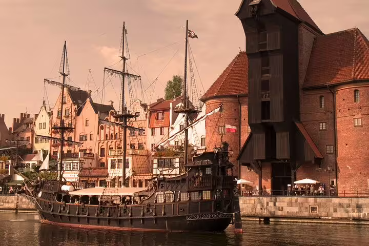 Gdansk Motlawa River with historic ship by the Crane, a top stop on the self-guided scavenger hunt tour