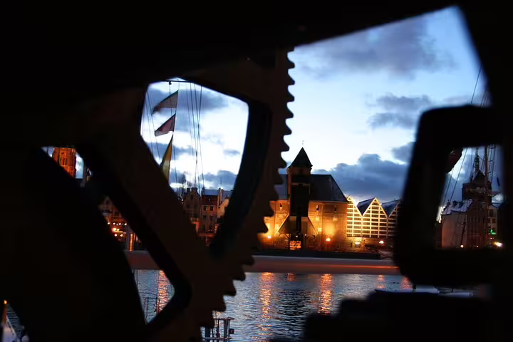 Gdansk waterfront at dusk framed by ship rigging, perfect for a self-guided scavenger hunt highlights tour