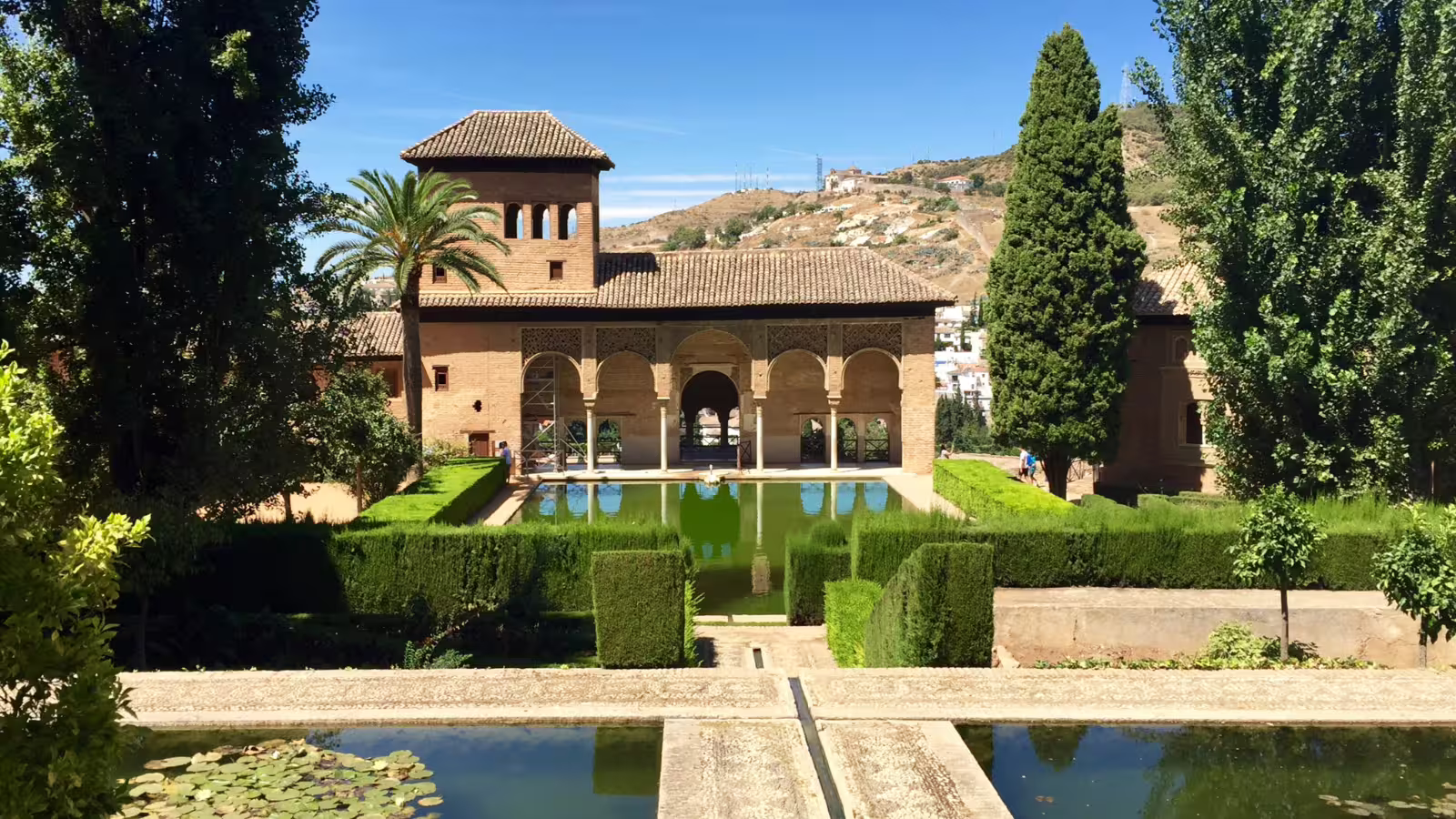 Generalife gardens and reflecting pool at the Alhambra in Granada on a private tour from Costa del Sol
