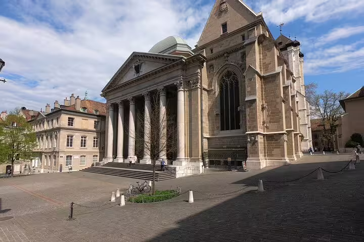 St. Pierre Cathedral and cobblestone plaza in Geneva's old town on a sunny day
