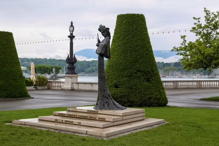 Bronze memorial statue of Empress Elisabeth of Austria on lakeside promenade in Geneva