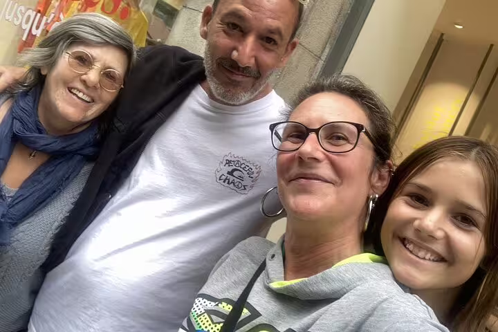 Group of four smiling participants on Geneva zombie city walking tour