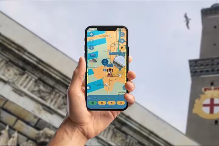 Hand holding smartphone displaying GPS self-guided tour map of Genoa with lighthouse and dock landmarks