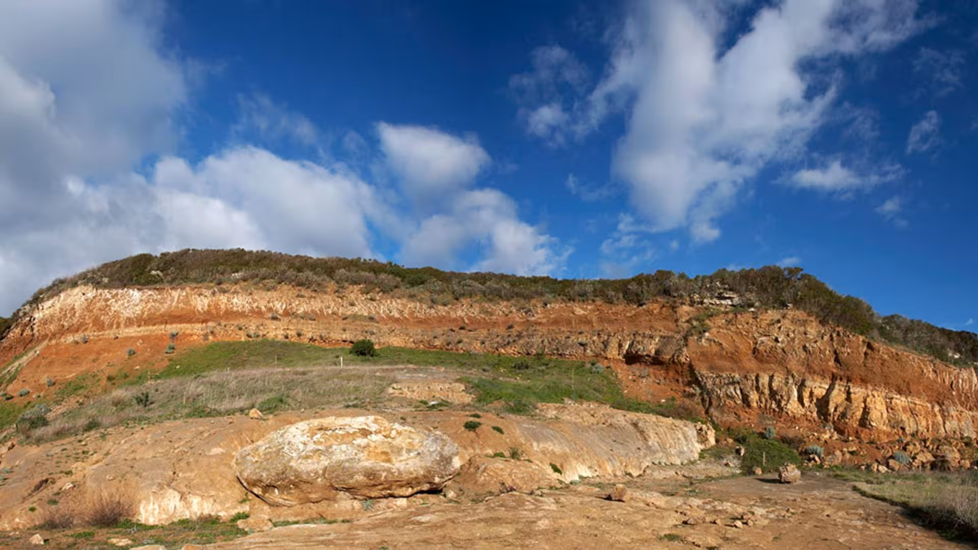 Rugged landscape of Giara Park with exposed rock formations, showcasing the geological wonders of Genoni.