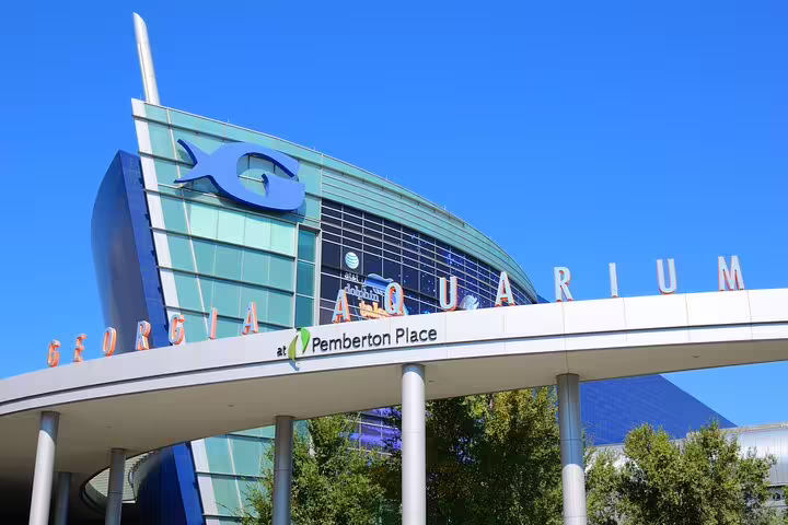 Georgia Aquarium exterior at Pemberton Place in Downtown Atlanta on a clear blue sky day