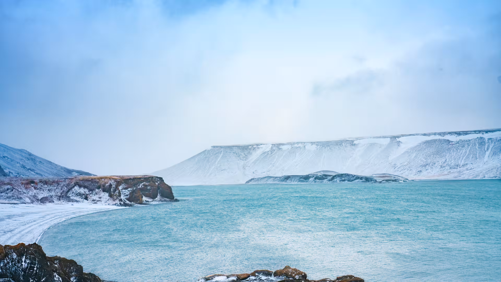 Snowy coastal bay in Iceland near Krýsuvík, dramatic winter scenery on the geothermal sprint adventure