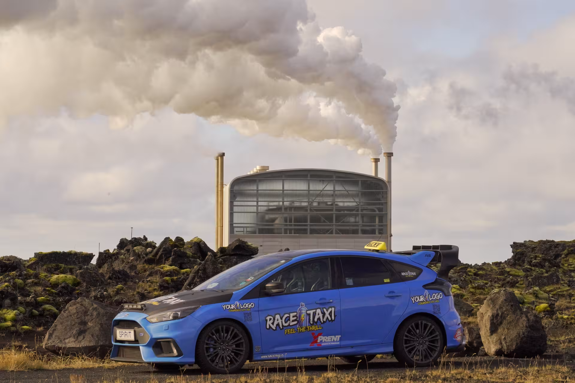 Race taxi car by geothermal power plant near Krýsuvík, Iceland, on high-speed geothermal sprint tour