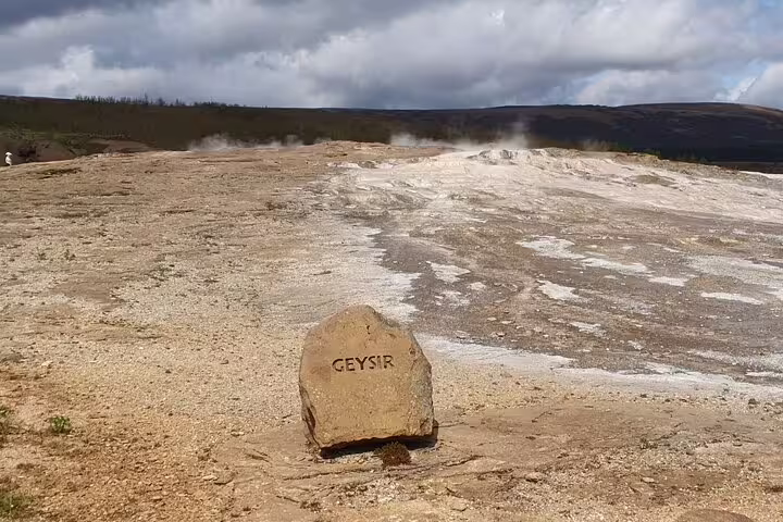 Geysir marker stone at the famous hot spring geothermal area in Iceland's Golden Circle