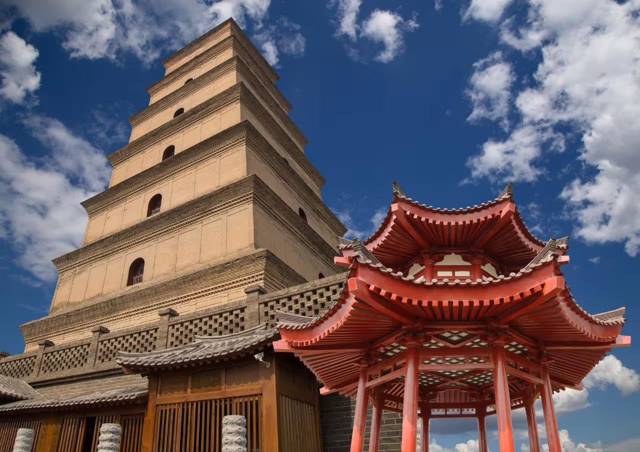 The iconic Giant Wild Goose Pagoda beneath a bright blue sky in Xi'an, highlighting its historical significance.