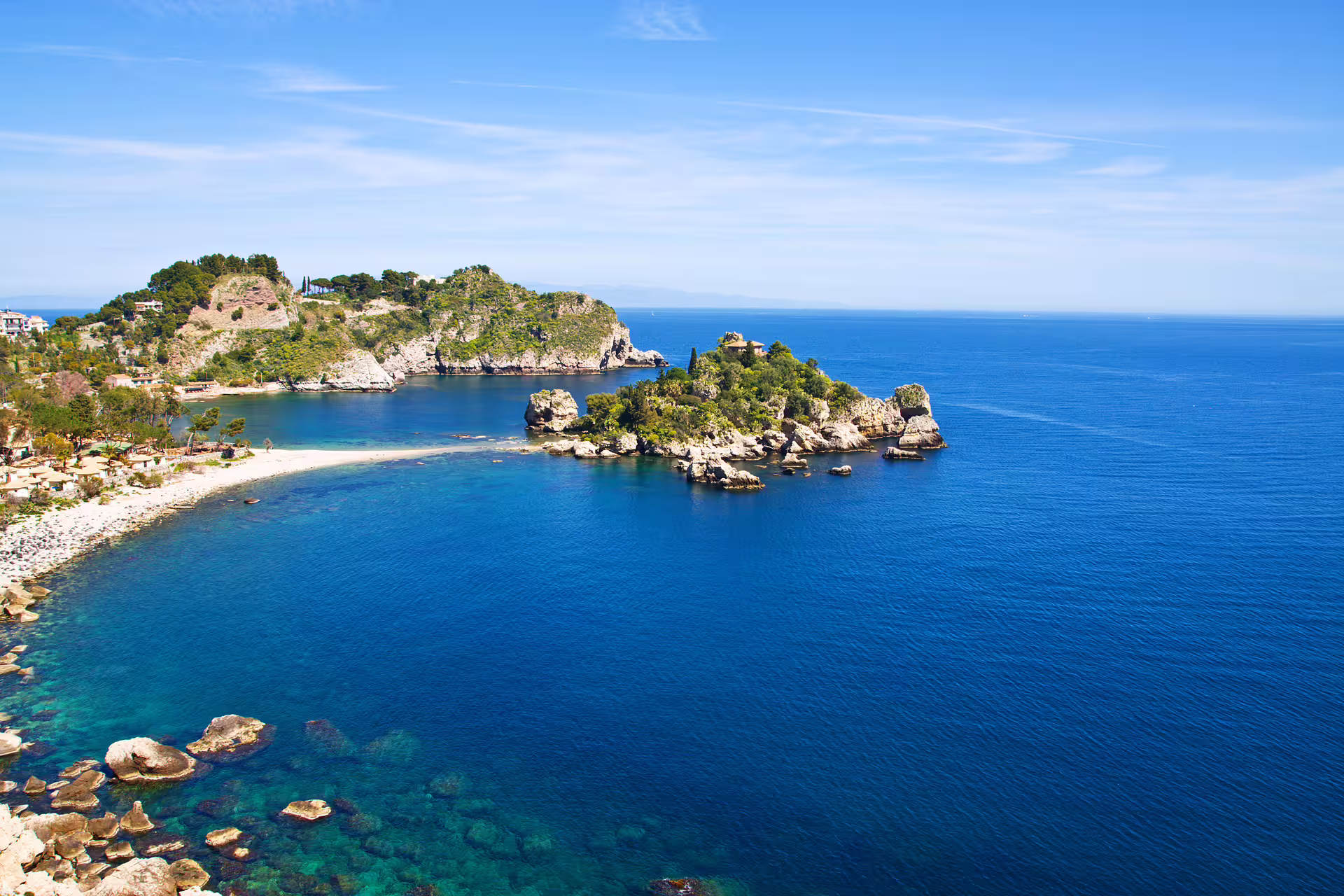 Giardini Naxos bay and Isola Bella coastline near Taormina on a small group Sicily day trip