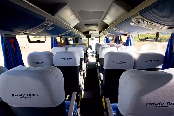 Comfortable seating inside a shuttle bus offering exclusive transfers from GIG Airport to Rio de Janeiro hotels.