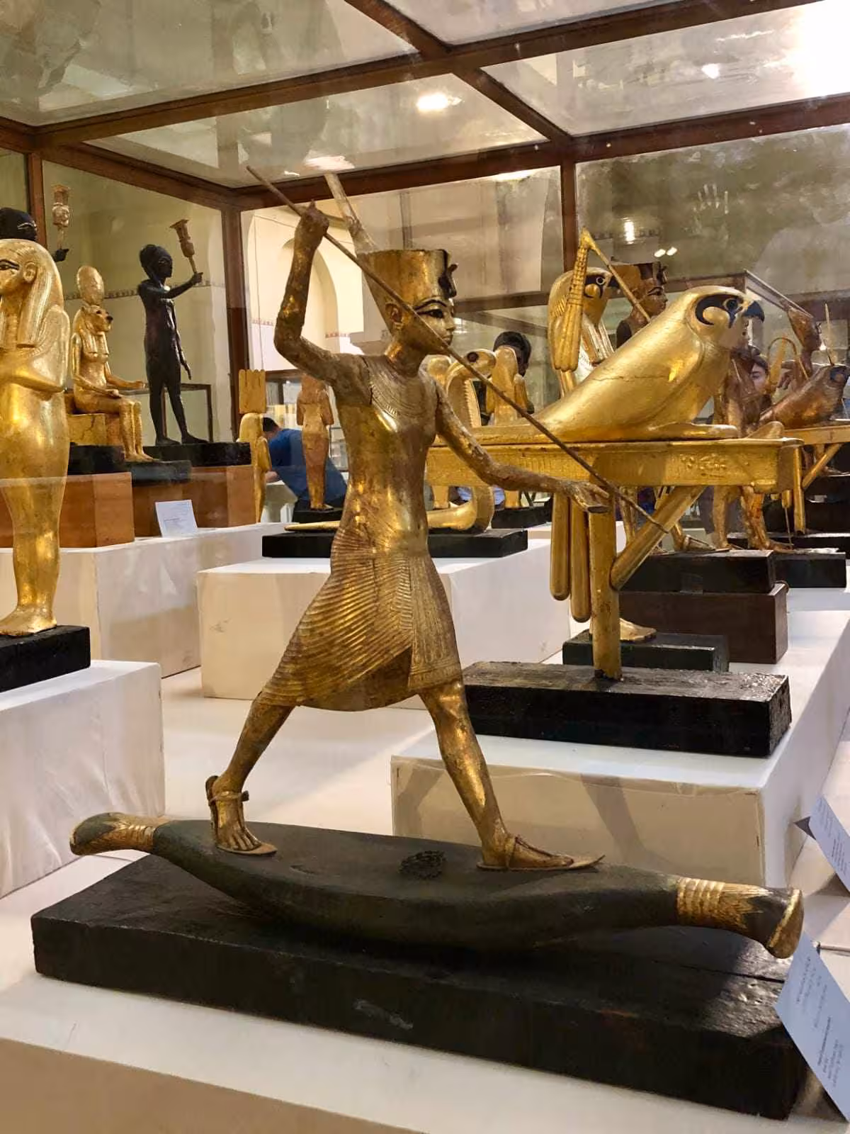 Gilded ancient Egyptian archer figure in the Egyptian Museum Cairo, seen on a private guided tour