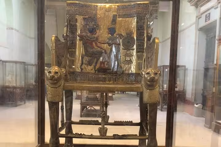 Gilded ancient Egyptian throne on display at the Egyptian Museum Cairo, highlight of a private guided tour