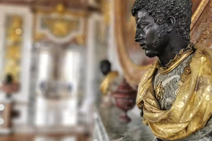 Close-up gilded statue inside Versailles Palace, highlight of guided tour with skip-the-line tickets
