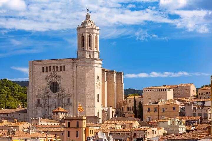 Historic Girona Cathedral against a blue sky, showcasing stunning architecture on a private city tour.