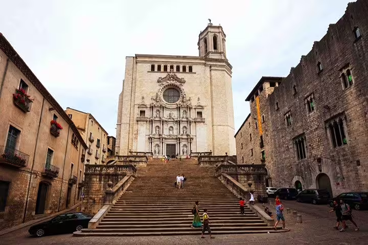 Majestic view of Girona Cathedral's grand staircase and historic architecture, highlighting cultural landmarks on the tour.