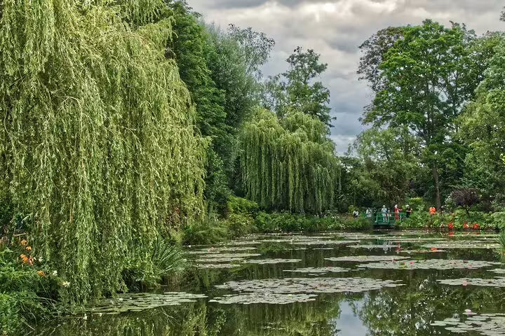 Monet's water lily pond with weeping willows and Japanese bridge at Giverny, France
