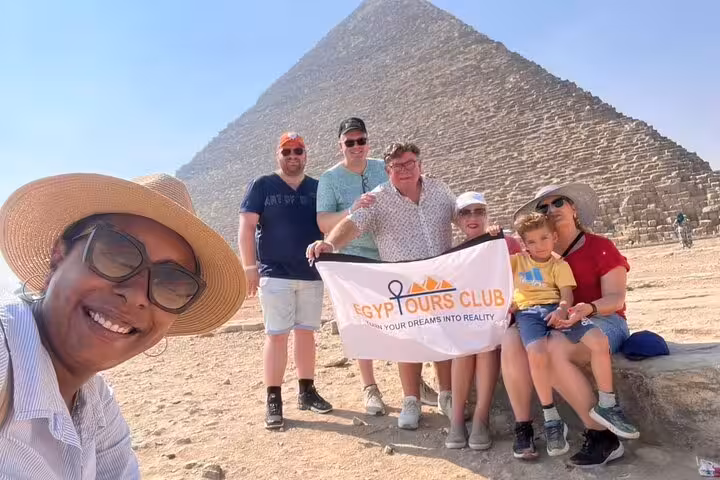 Tour group photo at the Great Pyramid of Giza, private Cairo day trip to Saqqara Step Pyramid and Memphis