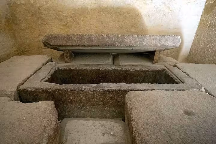 Ancient stone sarcophagus chamber inside a Giza pyramid, accessed with skip-the-line entry ticket