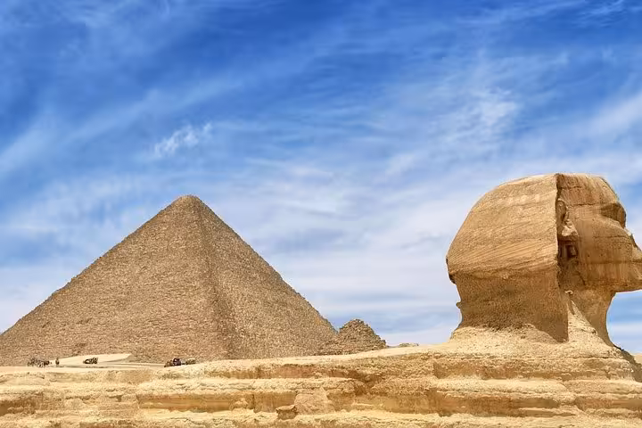 Great Sphinx and a Giza pyramid under blue sky, Cairo day trip from Hurghada Sahl Hashesh and Soma Bay