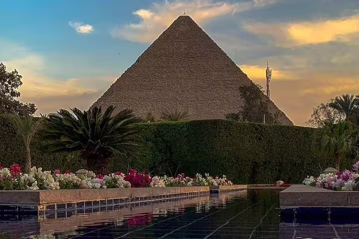 Great Pyramid of Giza at sunset with gardens and reflecting pool, private guided tour including transfers and tickets