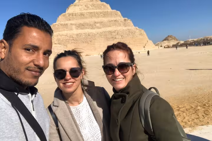 Private Giza Pyramids tour from Cairo Airport with guide, travelers selfie at Step Pyramid of Saqqara