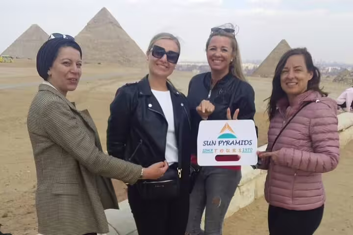 Group photo at Giza Pyramids during Cairo sightseeing, featured on 2-day Marsa Alam to Cairo & Luxor tour by flight