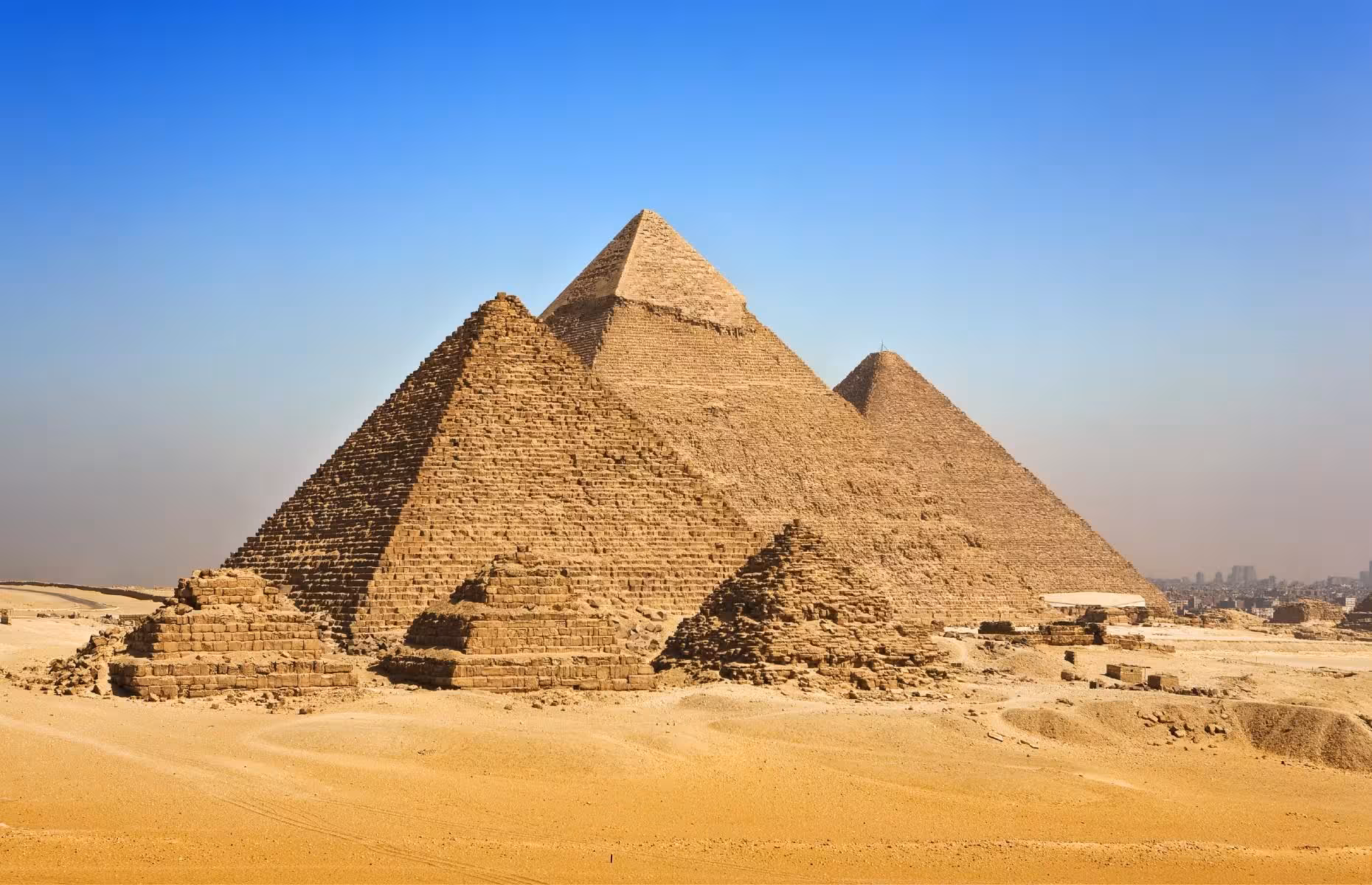 Giza Pyramids panoramic view on an 8-hour private Cairo tour, iconic ancient Egypt landmarks under blue sky