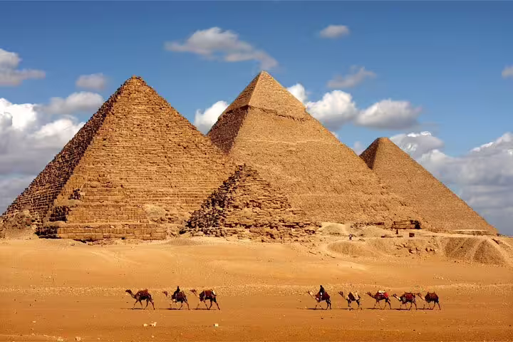 Giza Pyramids panorama with camel caravan, Cairo day tour by bus from Hurghada, Egypt highlights