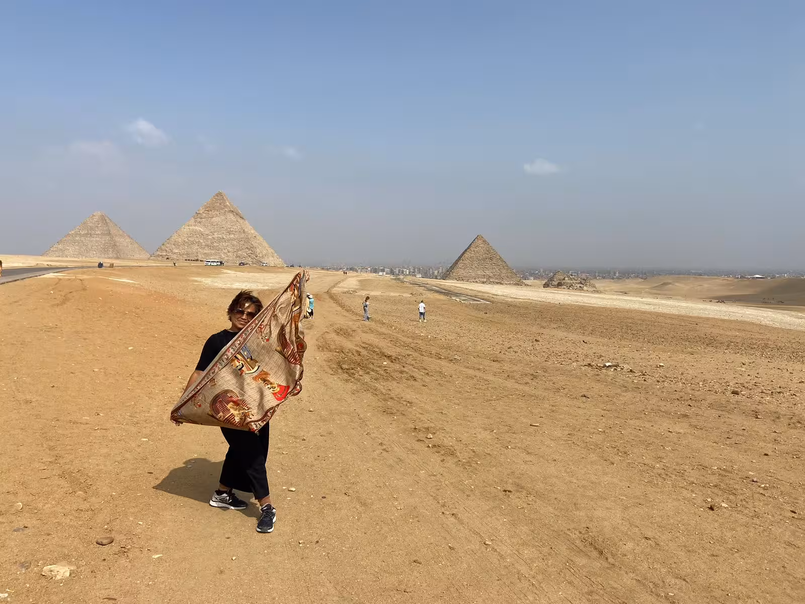 Desert viewpoint with three Giza pyramids near Cairo, perfect stop on a camel ride and lunch tour
