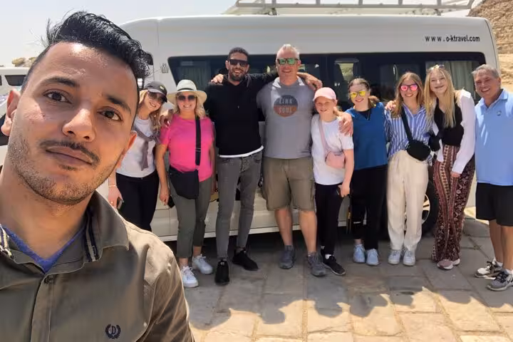 Happy tour group with Egypt guide by private van on Giza Pyramids, Egyptian Museum and Khan El Khalili tour