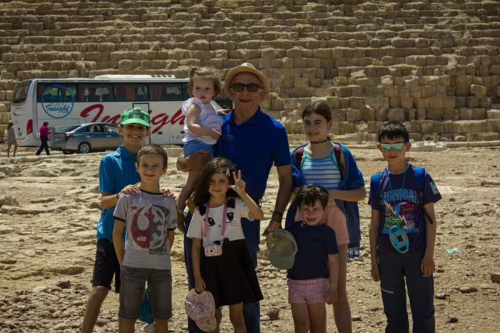 Family group photo at Giza Pyramids on Alexandria Port shore excursion with Nile cruise and lunch